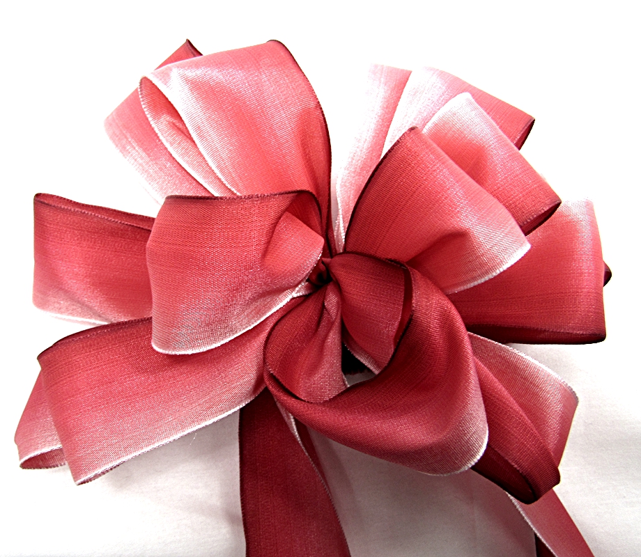 Pink gift ribbon bow. Pink red satin ribbon with knotted bow gift